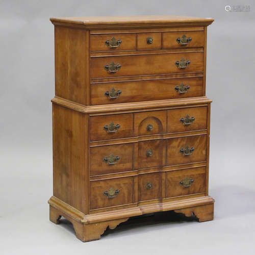 A late 20th century American cherrywood tallboy, fitted with...