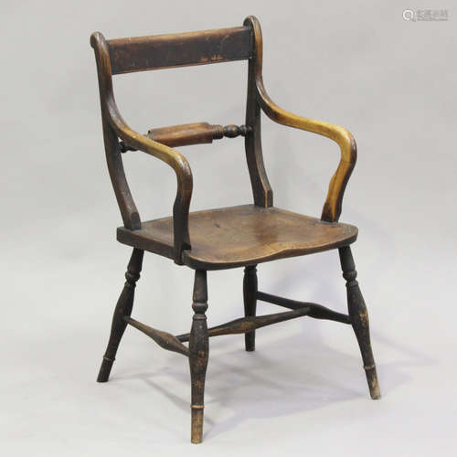 A 19th century provincial beech and elm bar back elbow chair...