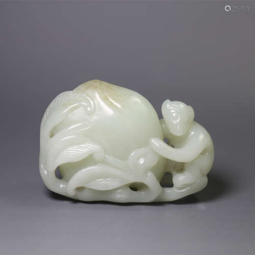 A jade carving of a monkey and peach