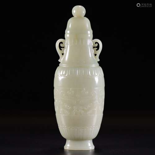 An archaistic jade tiger vase and cover