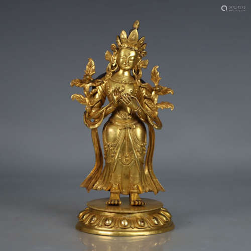 A gilt-bronze statue of tara