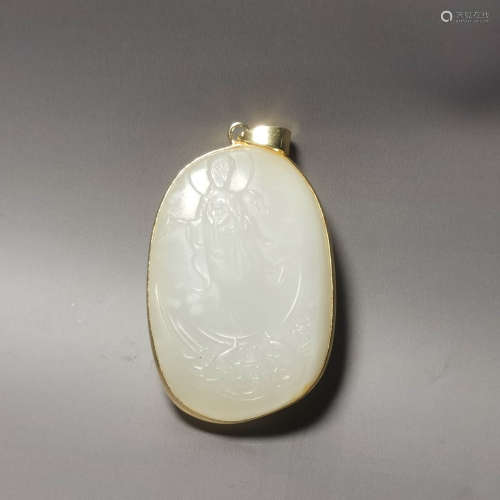 A carved jade buddha pendant