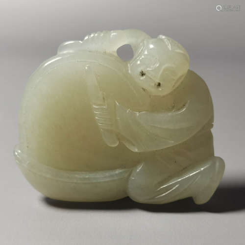 A carved jade figure pendant