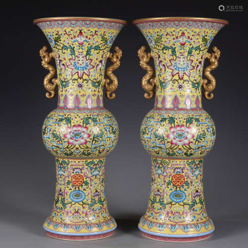 A pair of famille rose beaker vases
