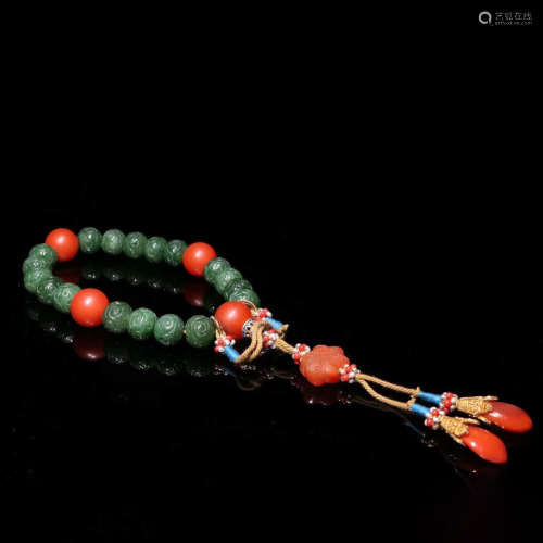 A carved 18 pieces beads spinach-green jade hand string