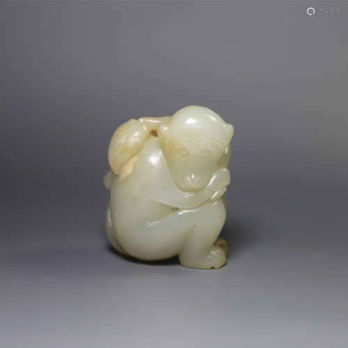 a jade carving of a monkey