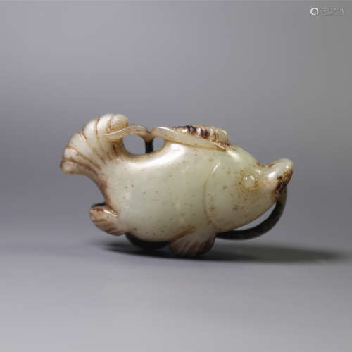 A carved jade fish pendant