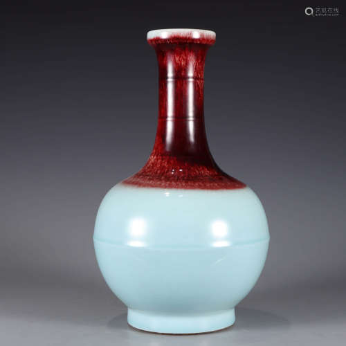 A flambe-glazed bottle vase