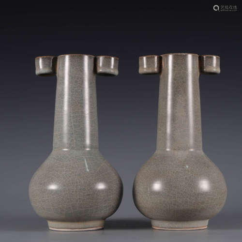 A pair of guan type pierced-eared vases