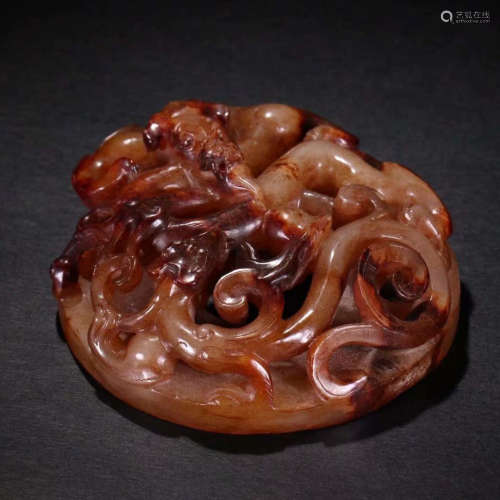 A carved dragon and phoenix jade bi