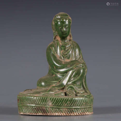 A green-enamelled Pottery figure of guanyin