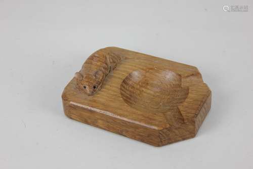 A Robert Mouseman Thompson oak ashtray, with carved signatur...