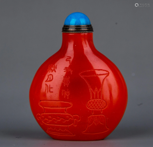 A CARVED CORAL-RED GLASS SNUFF BOTTLE.MARK OF QIANLONG