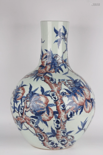 AN IRON-RED BLUE AND WHITE BOTTLE VASE.MARK OF