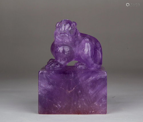 A CARVED PURPLE CRYSTAL 'BEAST' SEAL