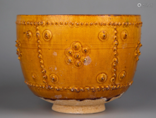 A YELLOW-GLAZED BOWL