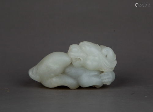 A CARVED WHITE JADE BEAST