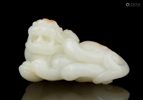 A CARVED WHITE JADE BEAST