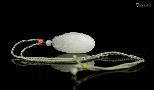 A CARVED WHITE JADE PENDANT