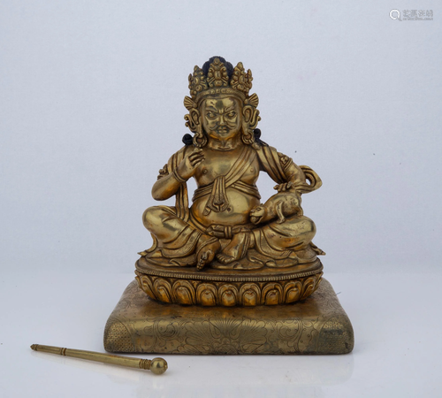 A GILT-BRONZE FIGURE OF KUBERA