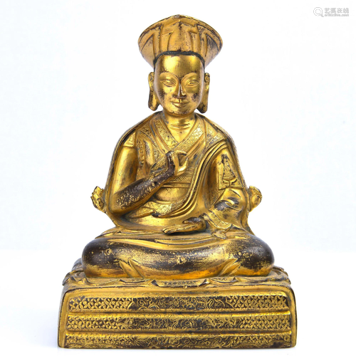 A GILT-BRONZE FIGURE OF GURU.QING PERIOD