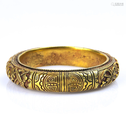 A GILT-SILVER BANGLE