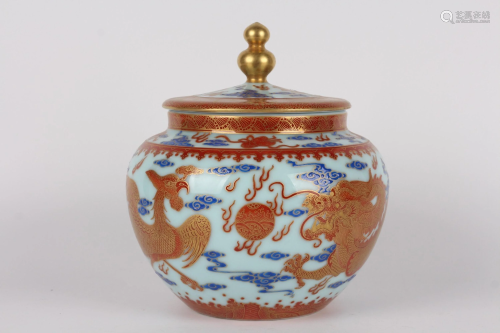 A COPPER-RED GILT-DECORATED JAR AND COVER.MARK …