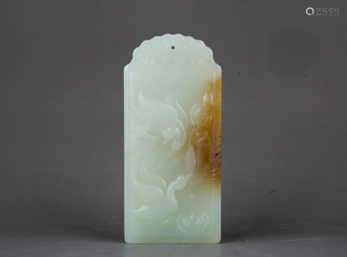 A CARVED WHITE JADE PENDANT