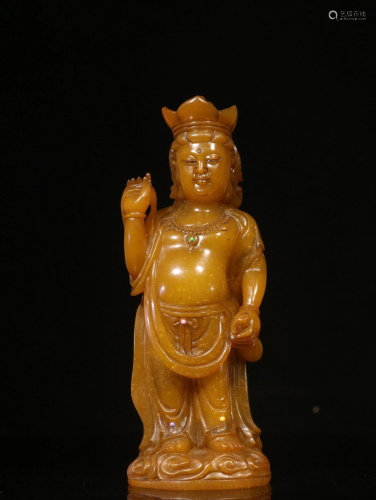 A CARVED SOAPSTONE STANDING GUANYIN
