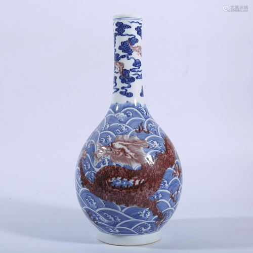 AN IRON-RED BLUE AND WHITE 'DRAGON' VASE.MARK OF