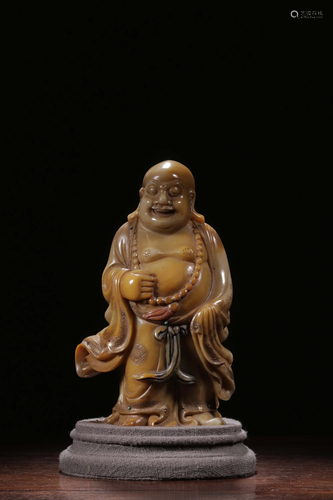 A CARVED SOAPSTONE BUDDHA