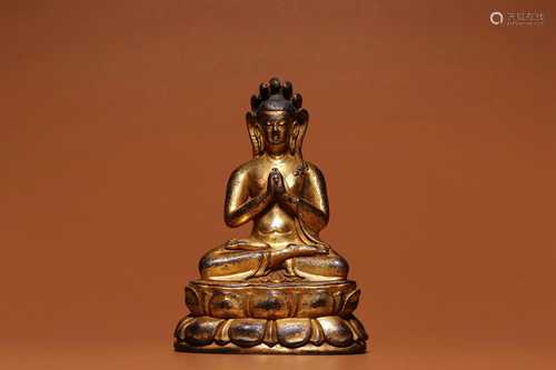 A GILT-BRONZE FIGURE OF BUDDHA.MING PERIOD