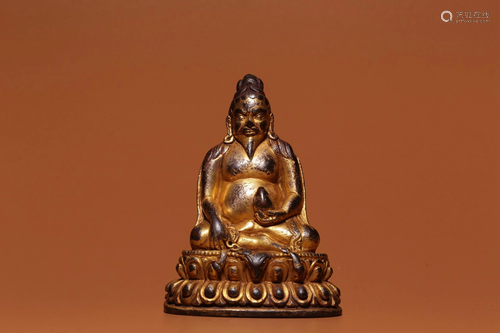 A GILT-BRONZE FIGURE OF PADAMPA SANGYE.MING PERIOD