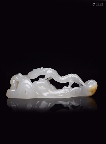 A CARVED WHITE JADE 'DRAGON' PEN REST.QING PERIOD