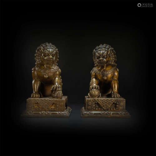 A pair of copper ornaments in lion form from Qing