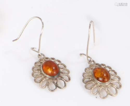 A pair of amber earrings mounted on silver