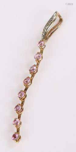 9 Carat gold pendant with 8 pink stones