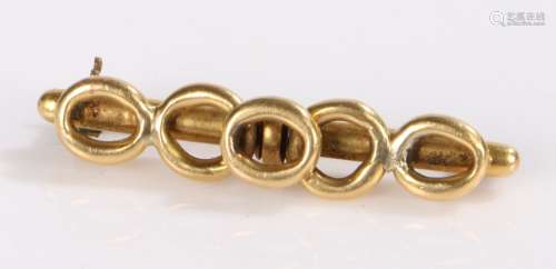 18 Carat Gold pin brooch, decorated with five loops, gross w...
