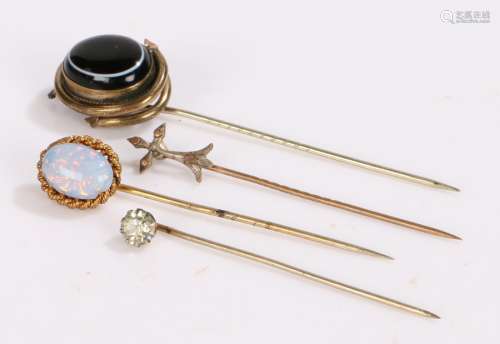 Four stick pins to include banded agate, and opal together w...