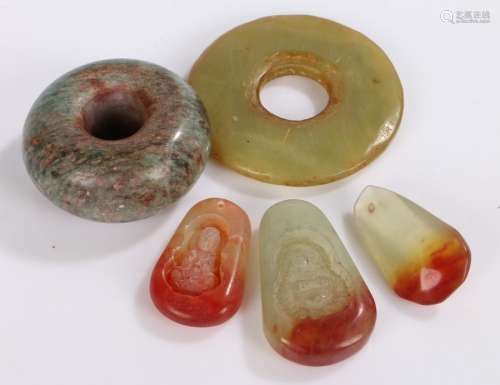 Collection of five hardstone carvings, to include two discs ...