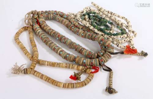 Four various bead necklaces, to include a string of prayer b...