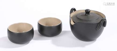 Contemporary Japanese tea set, with a black glazed pot and t...