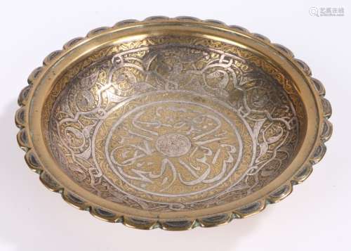 Middle Eastern dish, with silver inlay to the heavy brass bo...