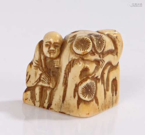 Japanese Edo period ivory Netsuke, with a figure near a rock...
