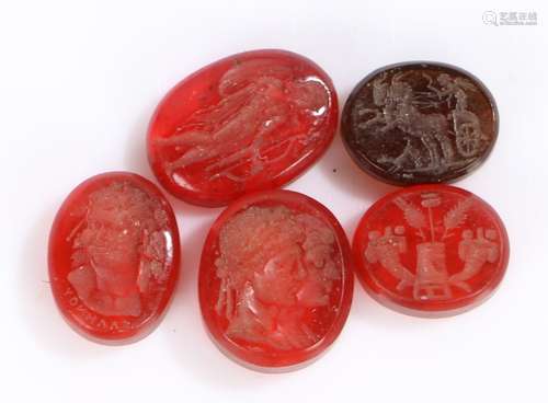 Five seal intaglios glasses, to include a Roman standing wit...