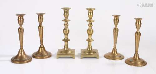 Three pairs of brass candlesticks, to include a knobbed pair...