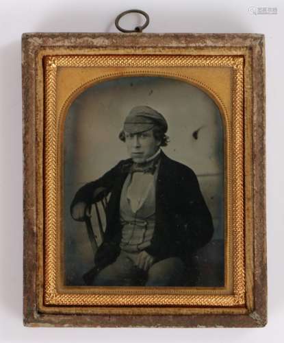 19th Century ninth plate ambrotype, of a seated man in a cap...
