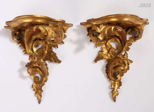 Pair of gilt wood rococo wall brackets, with a shaped shelf ...