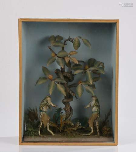 Unusual taxidermy display depicting Adam and Eve under the t...