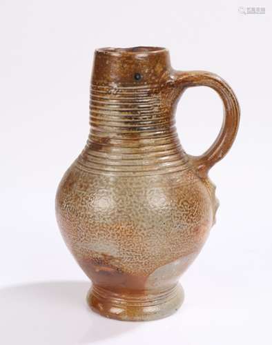 17th Century German salt glaze jug, with ring turned decorat...